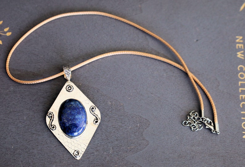 Gorgeous Lapis Lazuli 925 Silver Plated Handmade Pendant   Lapis lazuli is a deep-blue metamorphic rock that has been prized since antiquity for its intense color