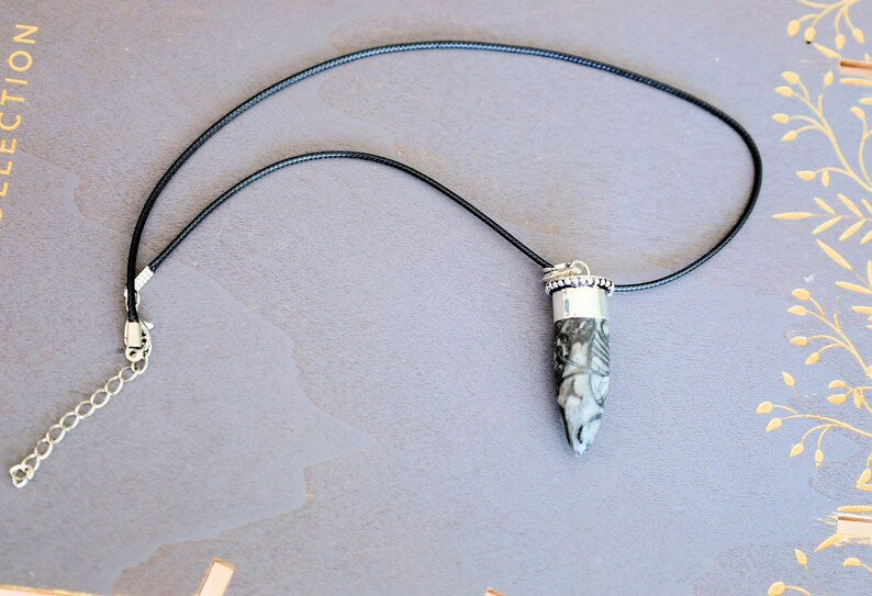 925 Silver Plated-Orthoceras   An Orthoceras pendant incorporates the fossilized remains of an ancient marine cephalopod that lived over 400 million years ago