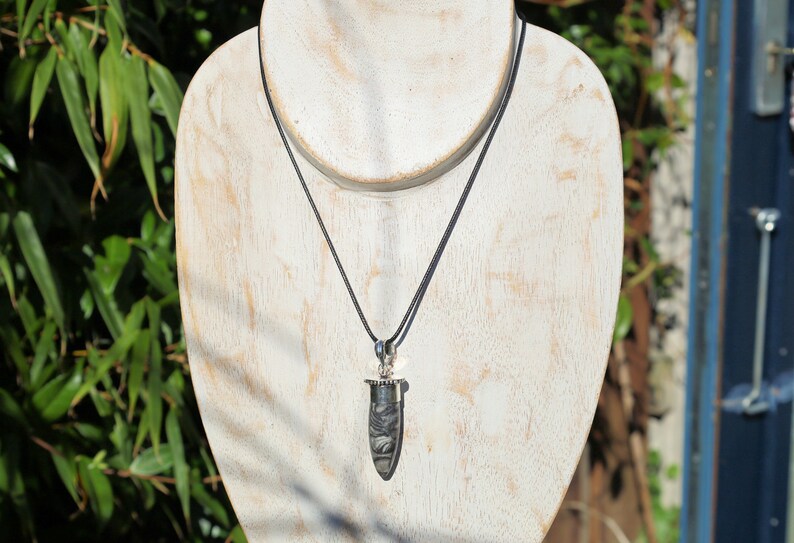 925 Silver Plated-Orthoceras   An Orthoceras pendant incorporates the fossilized remains of an ancient marine cephalopod that lived over 400 million years ago