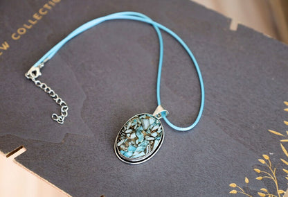 Copper Mohave Larimar  925, silver plated pendant.  Copper Mohave Larimar is a unique and visually striking stone that combines the serene qualities of Larimar with the conductive and enhancing properties of copper