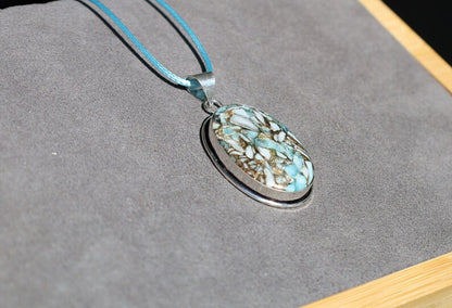 Copper Mohave Larimar  925, silver plated pendant.  Copper Mohave Larimar is a unique and visually striking stone that combines the serene qualities of Larimar with the conductive and enhancing properties of copper