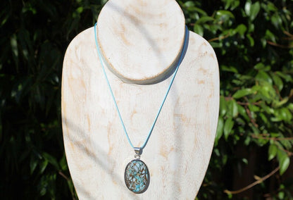 Copper Mohave Larimar  925, silver plated pendant.  Copper Mohave Larimar is a unique and visually striking stone that combines the serene qualities of Larimar with the conductive and enhancing properties of copper