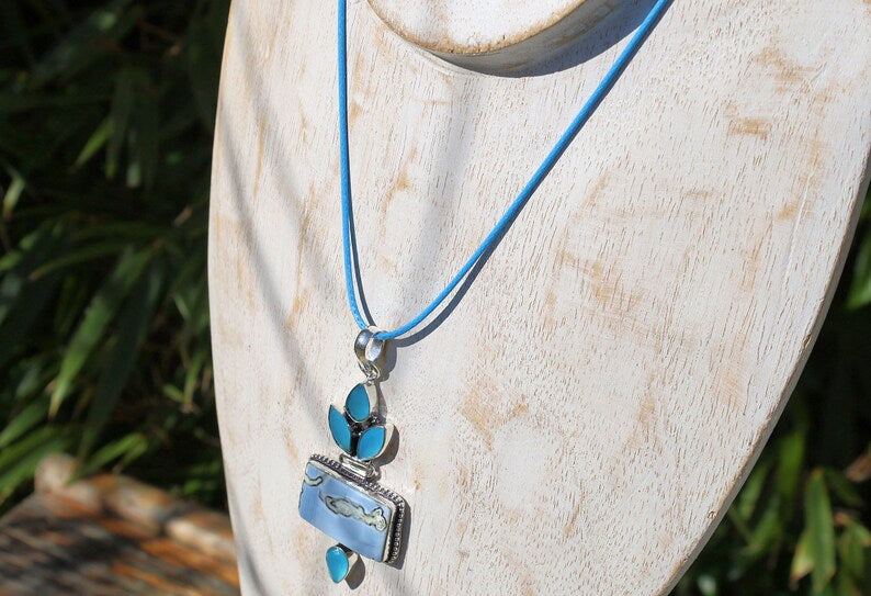 Owhyee Blue Opal and Blue Chalcedony   925 Silver Plated Handmade Pendant   Owyhee Blue Opal and Blue Chalcedony are both serene, blue-colored gemstones that exude calm and soothing energies