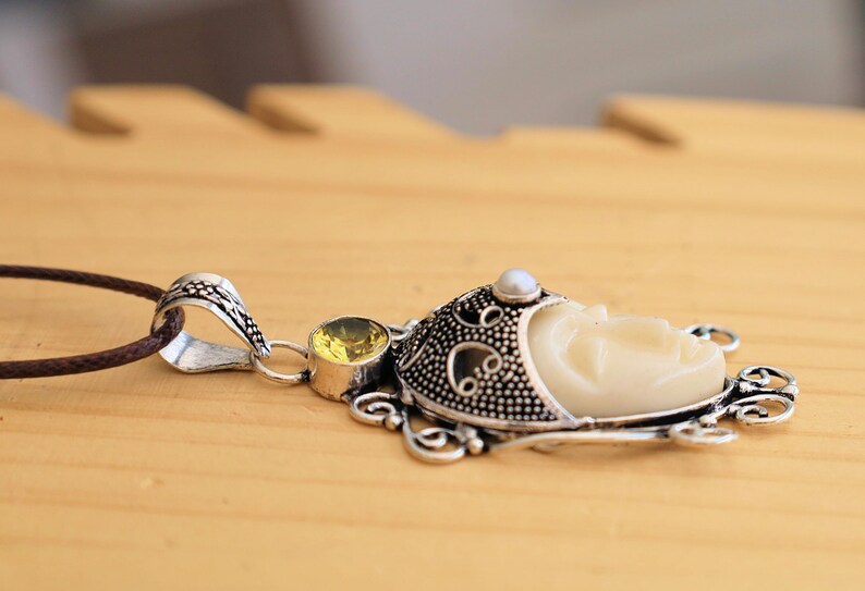 925 Silver Plated-Carved Face  Moonstone with Citrine. Bali Godess. the mystical and soothing energies of Moonstone with the vibrant and positive energies of Citrine