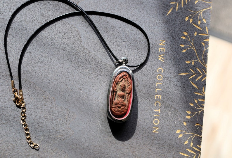 The Phra Khun Phaen (Split Egg) amulet created by Luang Por Dee of Wat Phra Rup in Suphanburi  is a unique and highly revered artifact
