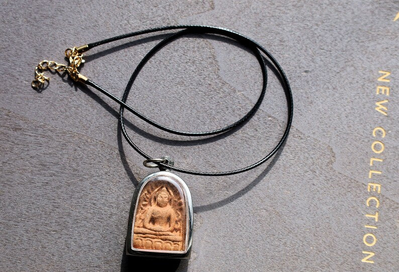 The Phra Soon Ko Song Knock, often referred to as the "Wealthy Buddha" amulet, is a fascinating piece within Thai Buddhist amulet culture