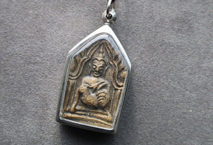 The Kun Peng+Ku Man Tong amulet represents a unique blend of Thai spiritual traditions, combining aspects of two distinct types