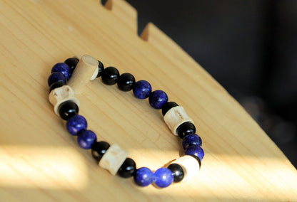 Real tribal Snake Vertebrae, Natural Bone Beads combined with Lapis Lazuli  and black Agate. The serpent jewelry teaches us purification.
