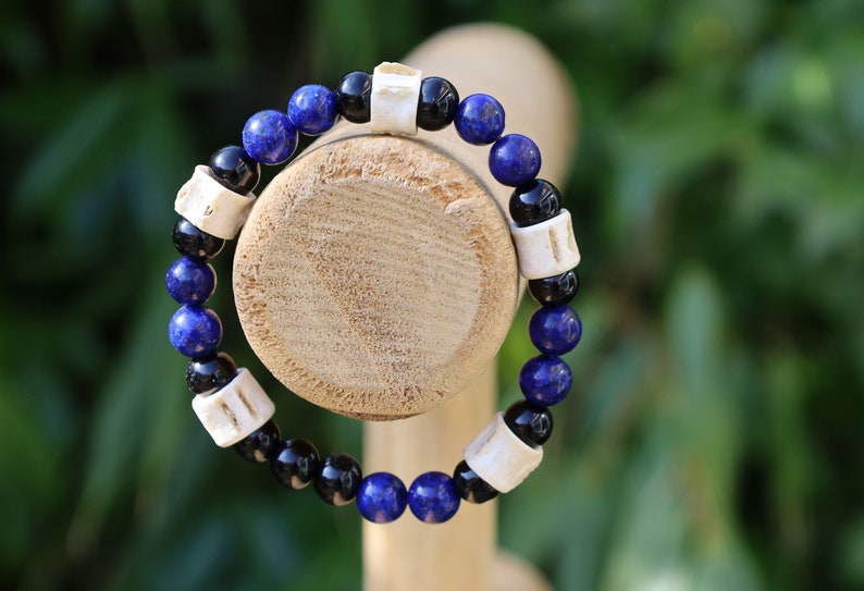 Real tribal Snake Vertebrae, Natural Bone Beads combined with Lapis Lazuli  and black Agate. The serpent jewelry teaches us purification.