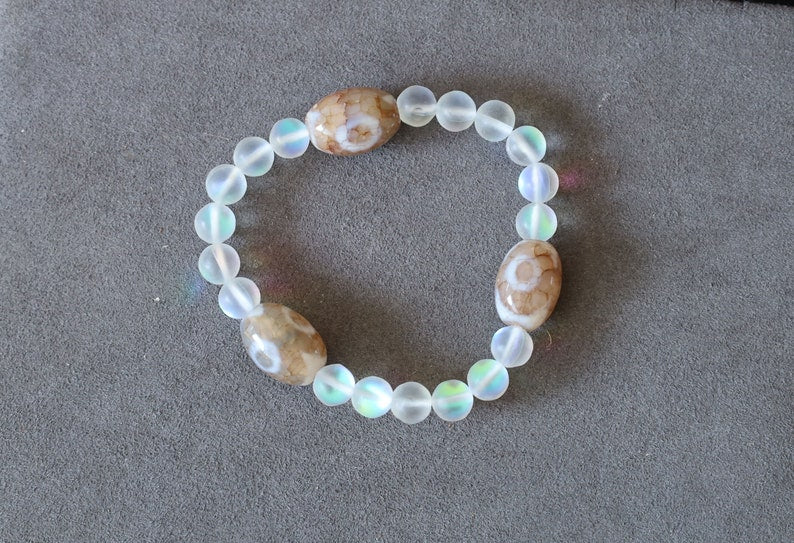 Three Dzi  barrel bead Agate bracelet with Matte Aurora Crystal Glass Beads," also known as "Frosted Mystic Aura Mermaid Beads