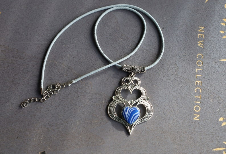 925 Silver Plated Blue white Calsilica  Calsilica,, is a man-made material known for its distinctive, highly individual appearance and vibrant layers of bold color.