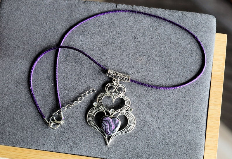 925 Silver Plated purple b/w Calsilica  Calsilica,, is a man-made material known for its distinctive, highly individual appearance and vibrant layers of bold color.
