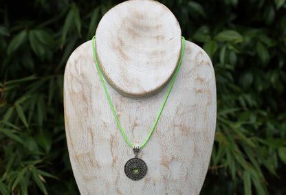 Peridot Art Piece. Peridot is a vibrant, green gemstone often associated with lightness and beauty. Traditionally, it's believed to bring healing and protective qualities, fostering a sense of well-being and emotional balance