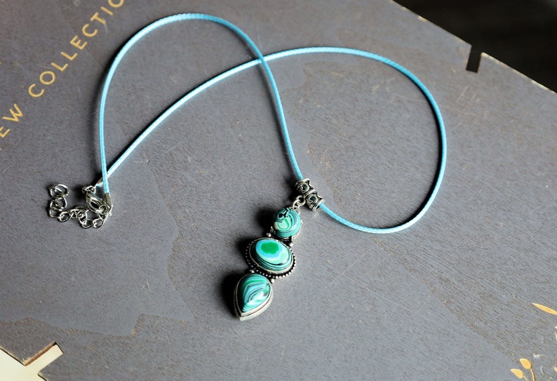 Green Calsilica pendant necklace. Traditionally, it's believed to bring healing and protective qualities