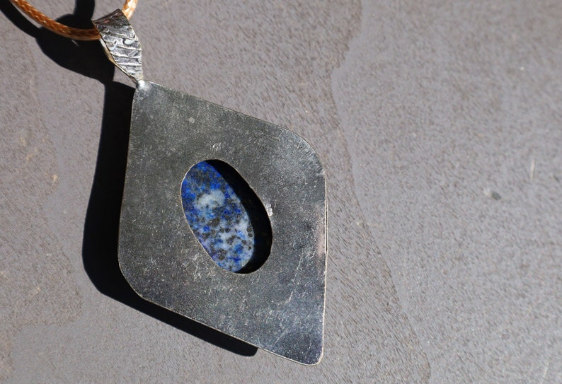 Gorgeous Lapis Lazuli 925 Silver Plated Handmade Pendant   Lapis lazuli is a deep-blue metamorphic rock that has been prized since antiquity for its intense color