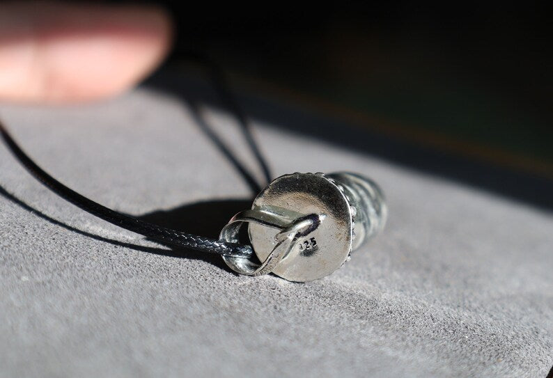 925 Silver Plated-Orthoceras   An Orthoceras pendant incorporates the fossilized remains of an ancient marine cephalopod that lived over 400 million years ago