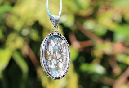 Copper Mohave Larimar  925, silver plated pendant.  Copper Mohave Larimar is a unique and visually striking stone that combines the serene qualities of Larimar with the conductive and enhancing properties of copper