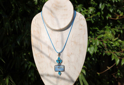 Owhyee Blue Opal and Blue Chalcedony   925 Silver Plated Handmade Pendant   Owyhee Blue Opal and Blue Chalcedony are both serene, blue-colored gemstones that exude calm and soothing energies