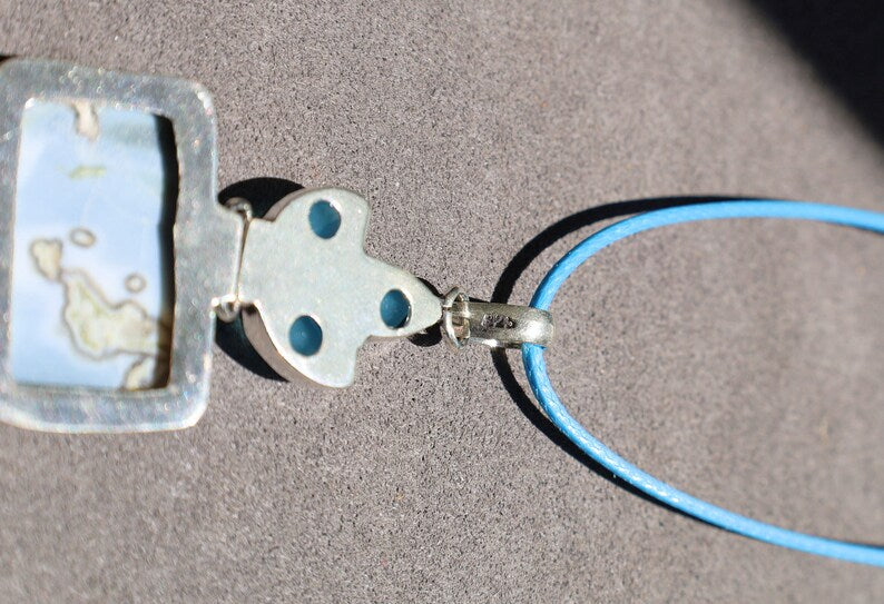 Owhyee Blue Opal and Blue Chalcedony   925 Silver Plated Handmade Pendant   Owyhee Blue Opal and Blue Chalcedony are both serene, blue-colored gemstones that exude calm and soothing energies