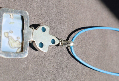 Owhyee Blue Opal and Blue Chalcedony   925 Silver Plated Handmade Pendant   Owyhee Blue Opal and Blue Chalcedony are both serene, blue-colored gemstones that exude calm and soothing energies