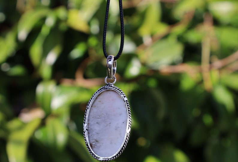 Scolecite, Amethyst 925, silver plated pendant.  Scolecite and Amethyst are both powerful crystals in the metaphysical world, each with unique properties and energies.