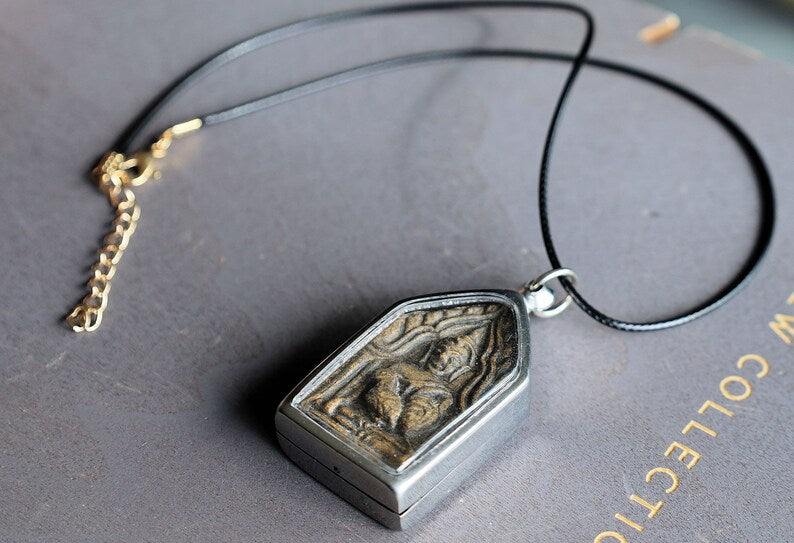 The Kun Peng+Ku Man Tong amulet represents a unique blend of Thai spiritual traditions, combining aspects of two distinct types