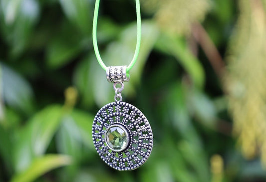 Peridot Art Piece. Peridot is a vibrant, green gemstone often associated with lightness and beauty. Traditionally, it's believed to bring healing and protective qualities, fostering a sense of well-being and emotional balance