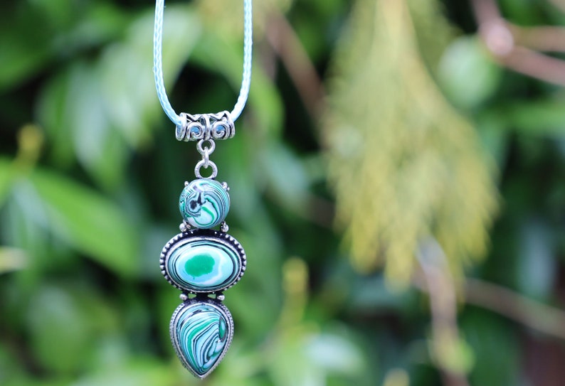 Green Calsilica pendant necklace. Traditionally, it's believed to bring healing and protective qualities