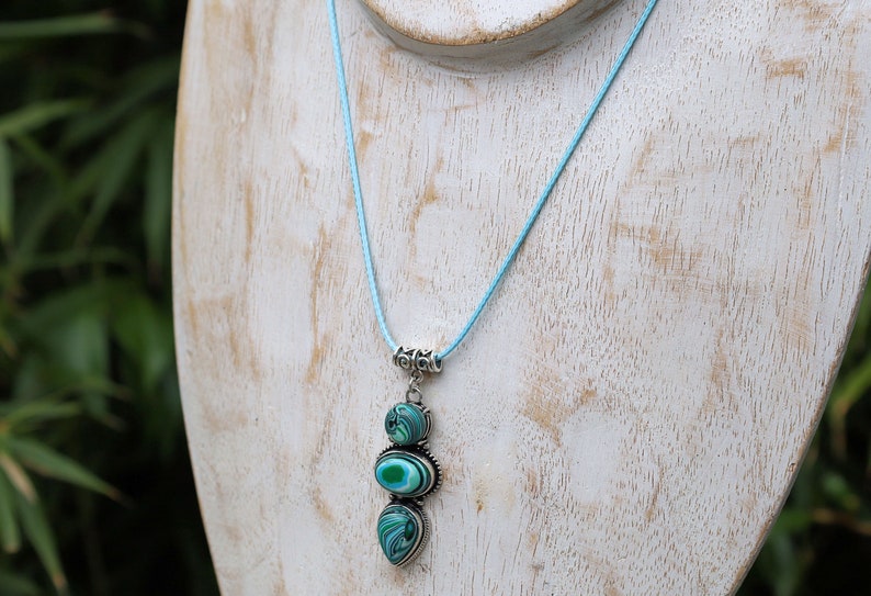 Green Calsilica pendant necklace. Traditionally, it's believed to bring healing and protective qualities