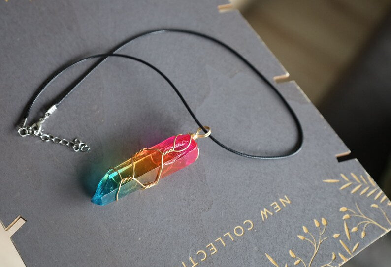 A Quartz Crystal Rainbow Stone pendant encompasses the natural beauty and energetic properties of quartz crystal