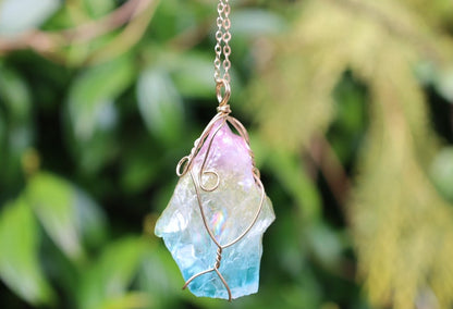 Colorful Quartz Crystal Rainbow Stone Wire Wrapped Crystal Pendant  A Quartz Crystal Rainbow Stone pendant encompasses the natural beauty and energetic properties of quartz crystal