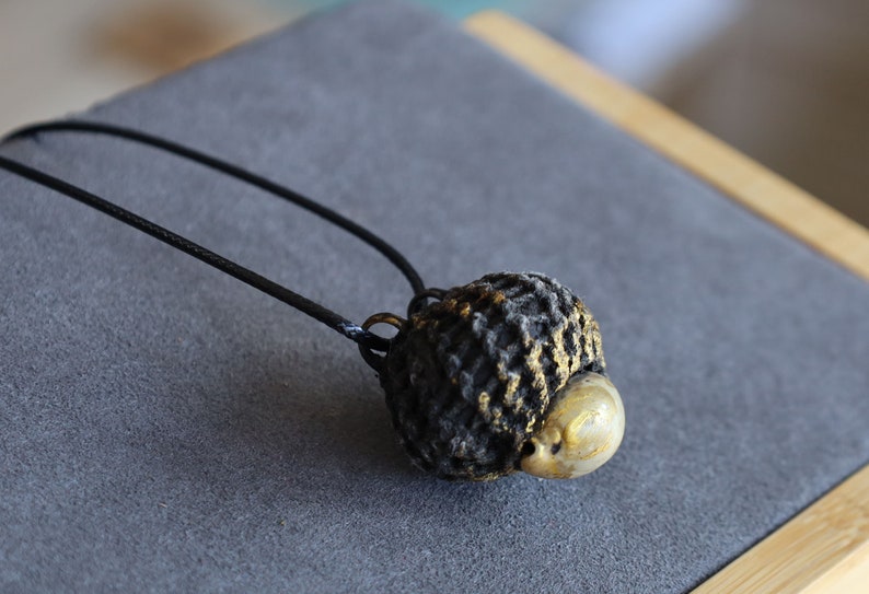 Takrut Bia Kae Shell Thai Amulet Buddha Pendant Talisman" likely holds significant cultural and spiritual meaning within Thai Buddhism