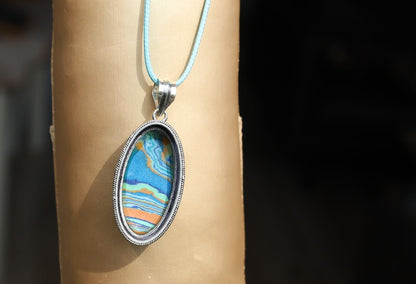 Rainbow Calsilica 925 Silver Plated Handmade Pendant. Rainbow calsilica is a colorful and intriguing material often used in jewelry and decorative objects