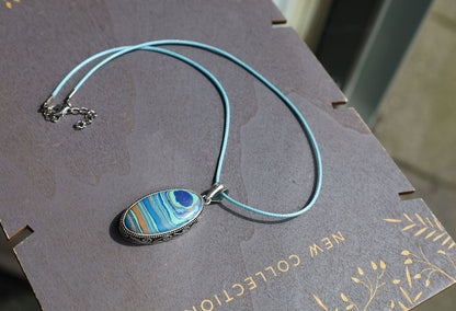 Rainbow Calsilica 925 Silver Plated Handmade Pendant. Rainbow calsilica is a colorful and intriguing material often used in jewelry and decorative objects
