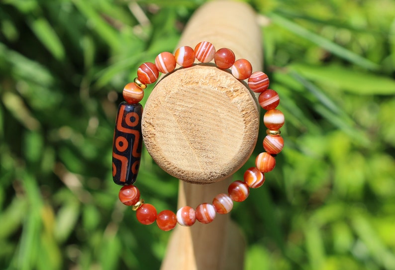 Nine-eye dZi bead with beautiful Orange striped agate beads. The Star of Prosperity and the Heaven Protection