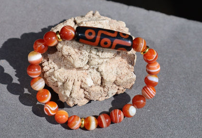 Nine-eye dZi bead with beautiful Orange striped agate beads. The Star of Prosperity and the Heaven Protection