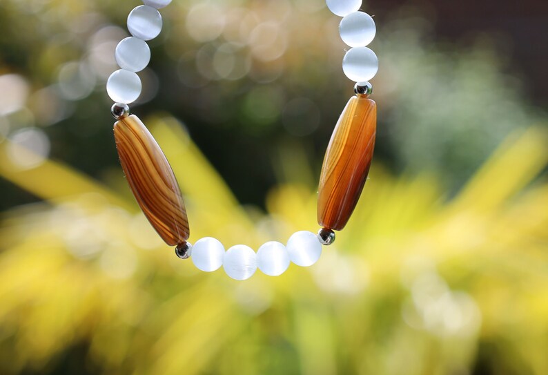3x  unique brown Tibetan Natural Agate DZi with  Blue and purple opal beads. making it an exceptional piece for meditation and protection.