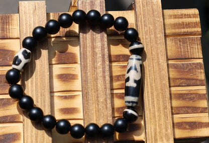 Nectar vesse" Dzi bead with Matte onyx beads and 3 medicine dzi beads. helping to balance the body's energies