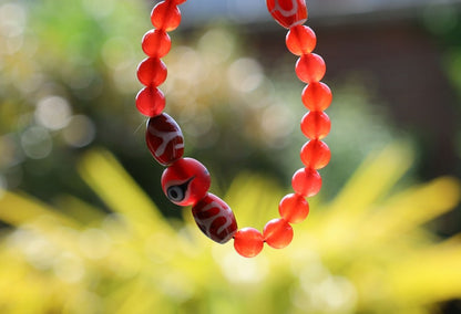Big man 3x dzi with Carnelian beads and a Evil Eye Glass Bead. The stone helps to solve problems and release stress