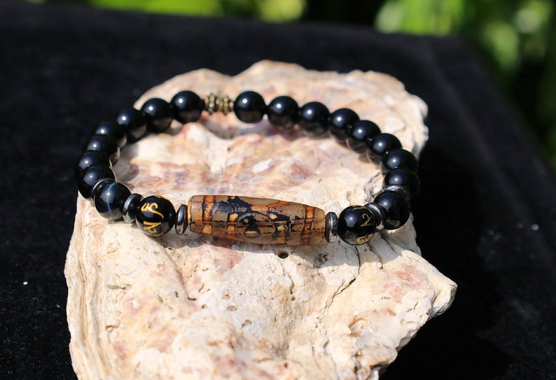Three-eye dZi bead with black onyx beads and With Agate Om mani padme hum beads. jewel in the lotus.