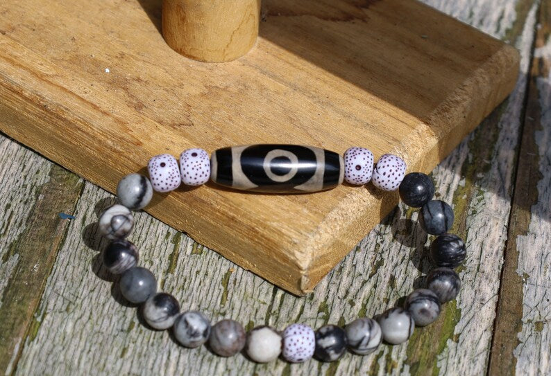 Three-eye dZi bead with  Starmoon Bodhi Barrel Beads and Black silk stone beads. This is one of the most powerful beads