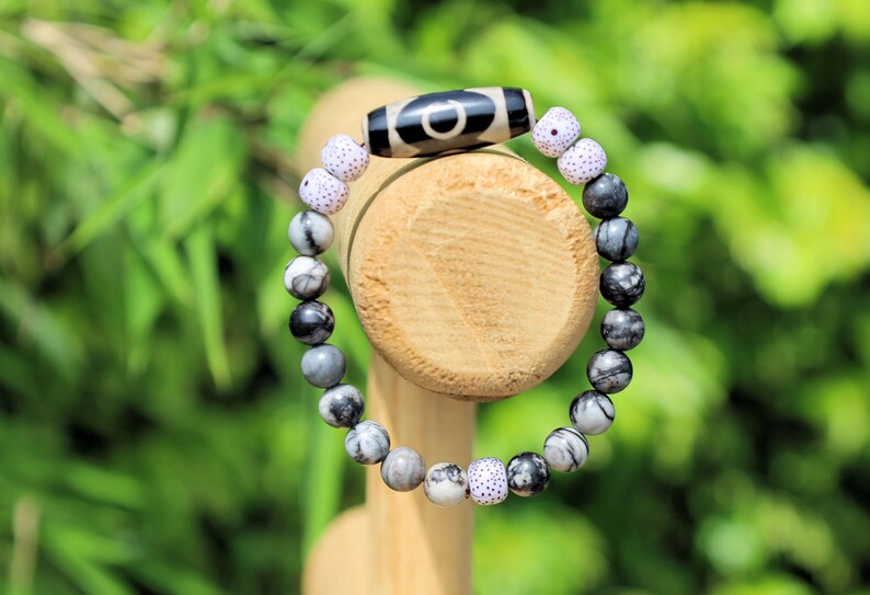 Three-eye dZi bead with  Starmoon Bodhi Barrel Beads and Black silk stone beads. This is one of the most powerful beads