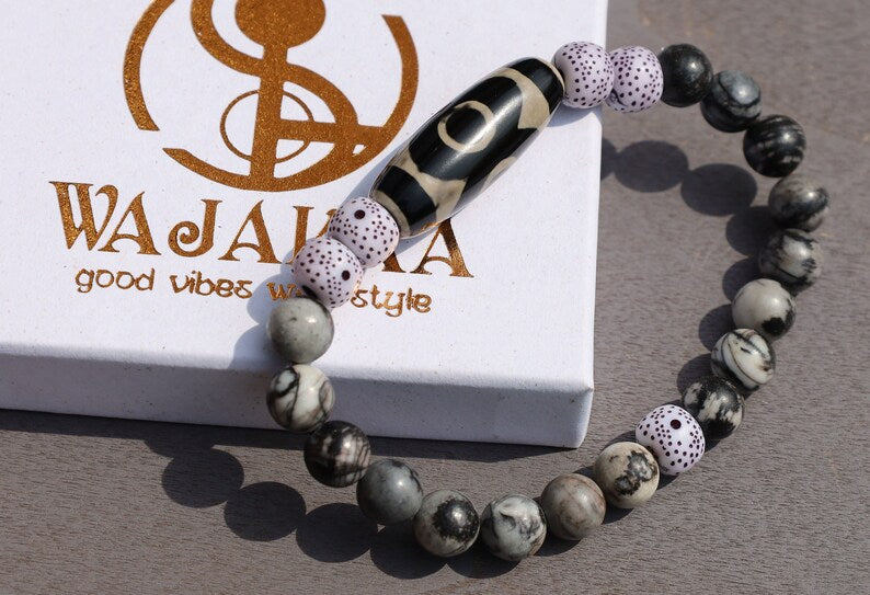 Three-eye dZi bead with  Starmoon Bodhi Barrel Beads and Black silk stone beads. This is one of the most powerful beads