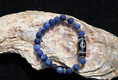 Three-eye dZi bead with   Blue Jasper and 6x Chevron-style tradebeads. connects you to the spiritual world.