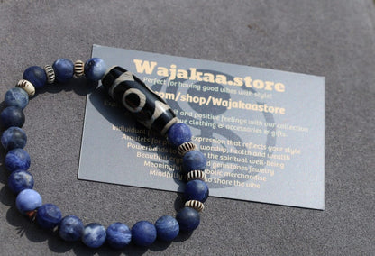 Three-eye dZi bead with   Blue Jasper and 6x Chevron-style tradebeads. connects you to the spiritual world.