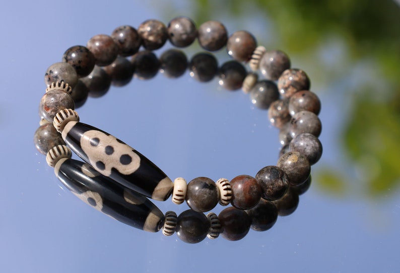 Seven-eye dZi bead with Yooperlite is a new crystal that was recently discovered in lake Superior near Michigan. And Chevron beads