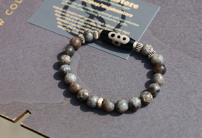 Seven-eye dZi bead with Yooperlite is a new crystal that was recently discovered in lake Superior near Michigan. And Chevron beads