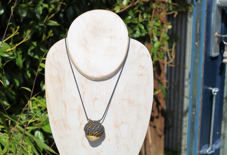 Takrut Bia Kae Shell Thai Amulet Buddha Pendant Talisman" likely holds significant cultural and spiritual meaning within Thai Buddhism