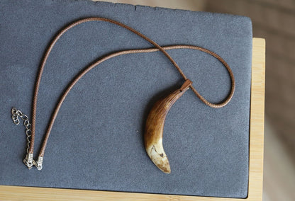 Wild Boar Teeth Natural Bone necklace. hunting traditions and are worn as symbols of bravery,strength,and connection to the outdoors