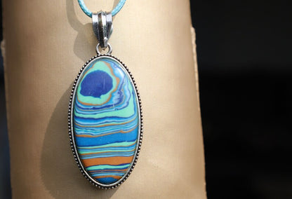 Rainbow Calsilica 925 Silver Plated Handmade Pendant. Rainbow calsilica is a colorful and intriguing material often used in jewelry and decorative objects